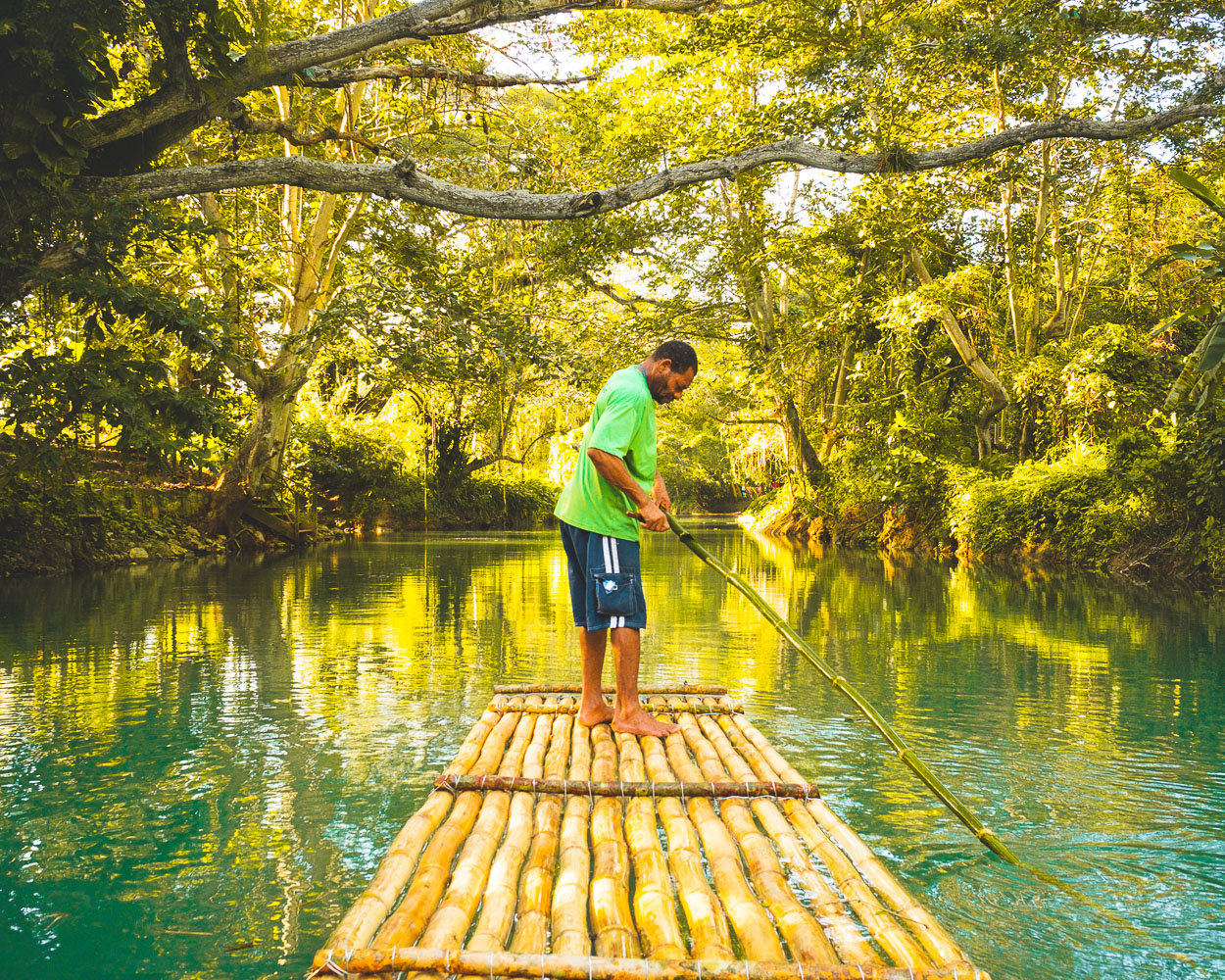 Bamboo rafts on the calm green waters of the Martha Brae River