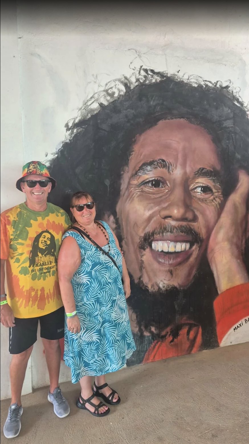 Catherine Owen and her husband at the Bob Marley mural